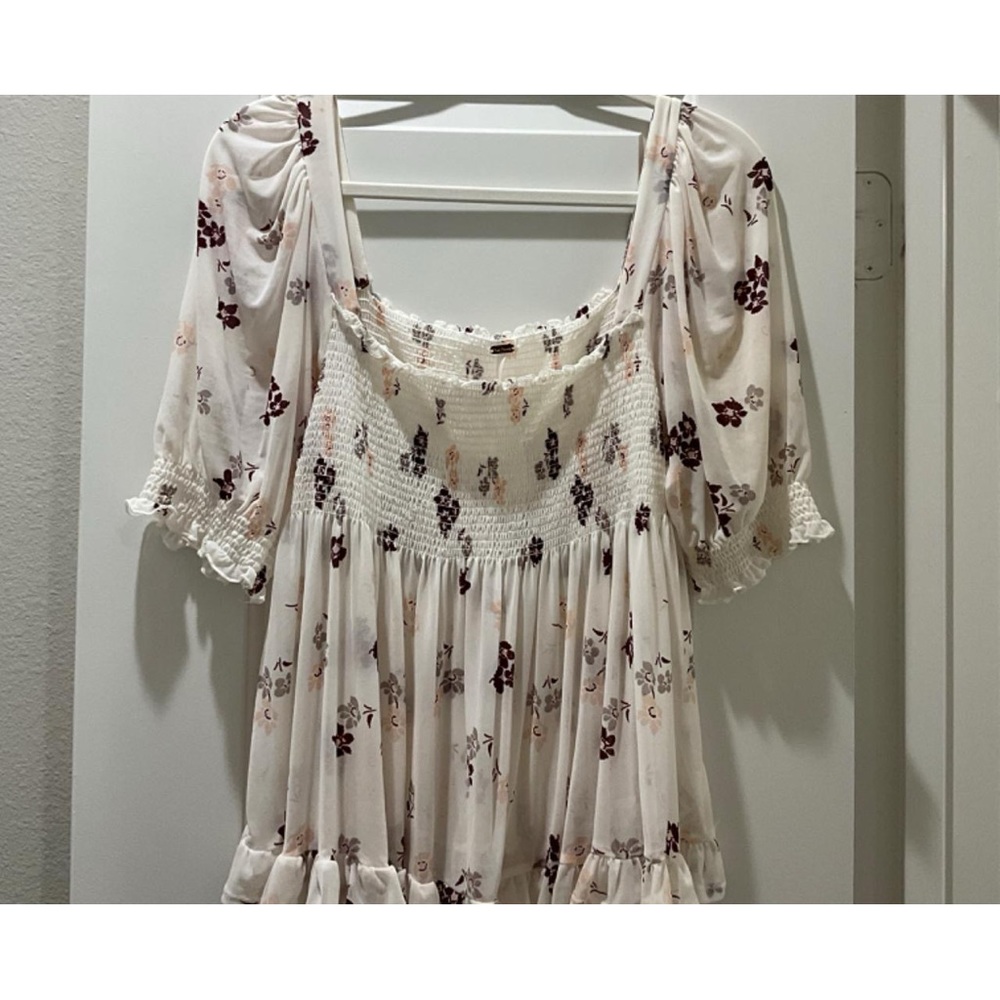 Off the shoulder (can be worn on shoulder) see through on the bottom half